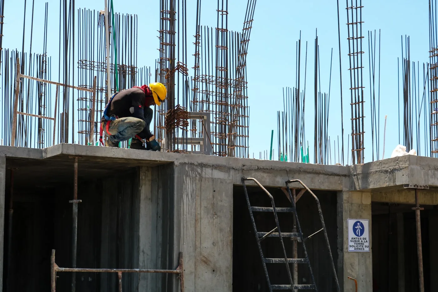 A reinforced concrete frame taking shape — the structural skeleton that every luxury finish is later built upon