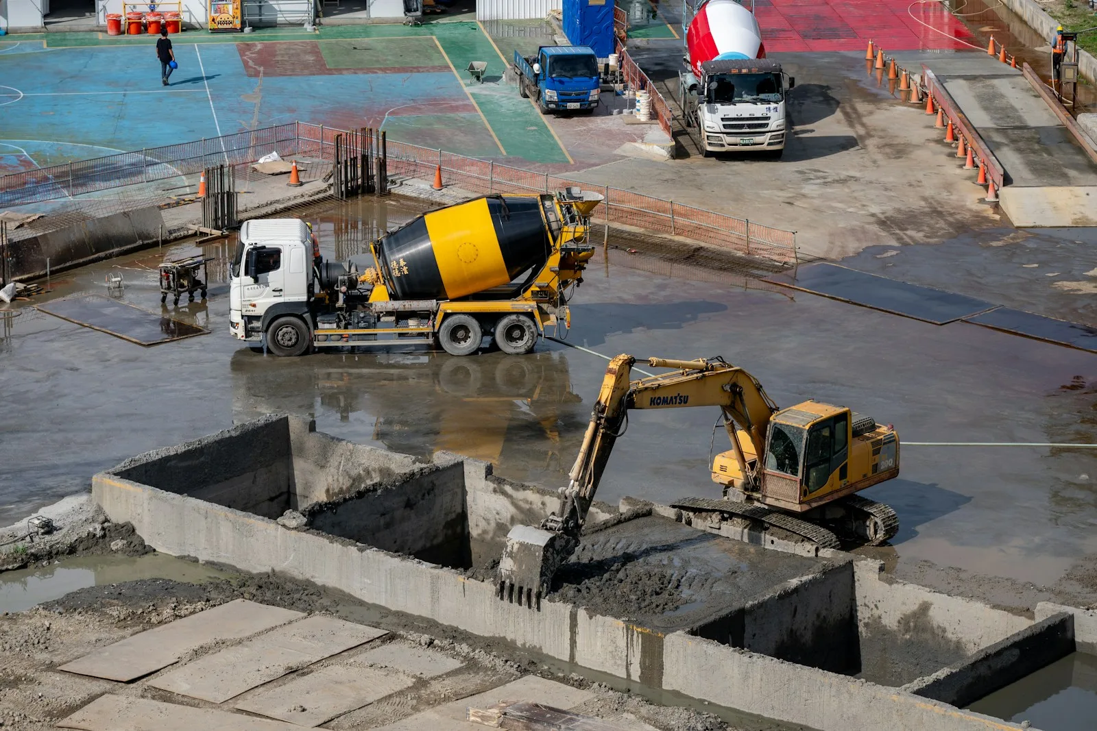 Months 0–2: excavation and reinforced foundations — the stage that carries everything above it and is engineered to the site's own soil